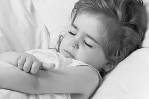 Little girl scratching the crook of her arm